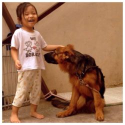 Michael's daughter with his dog